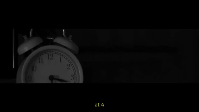 Cinematic scene featuring an alarm clock and English captions